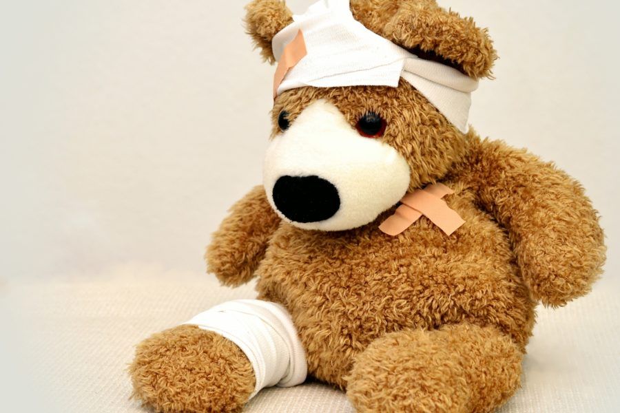 A teddy bear wrapped in bandages